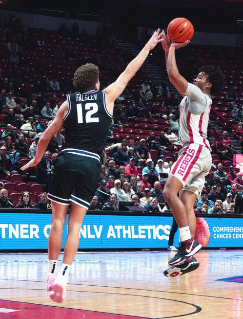 UNLV guard Dedan Thomas Jr. (11) sets up for a game winning shot against Utah State Aggies guar ...