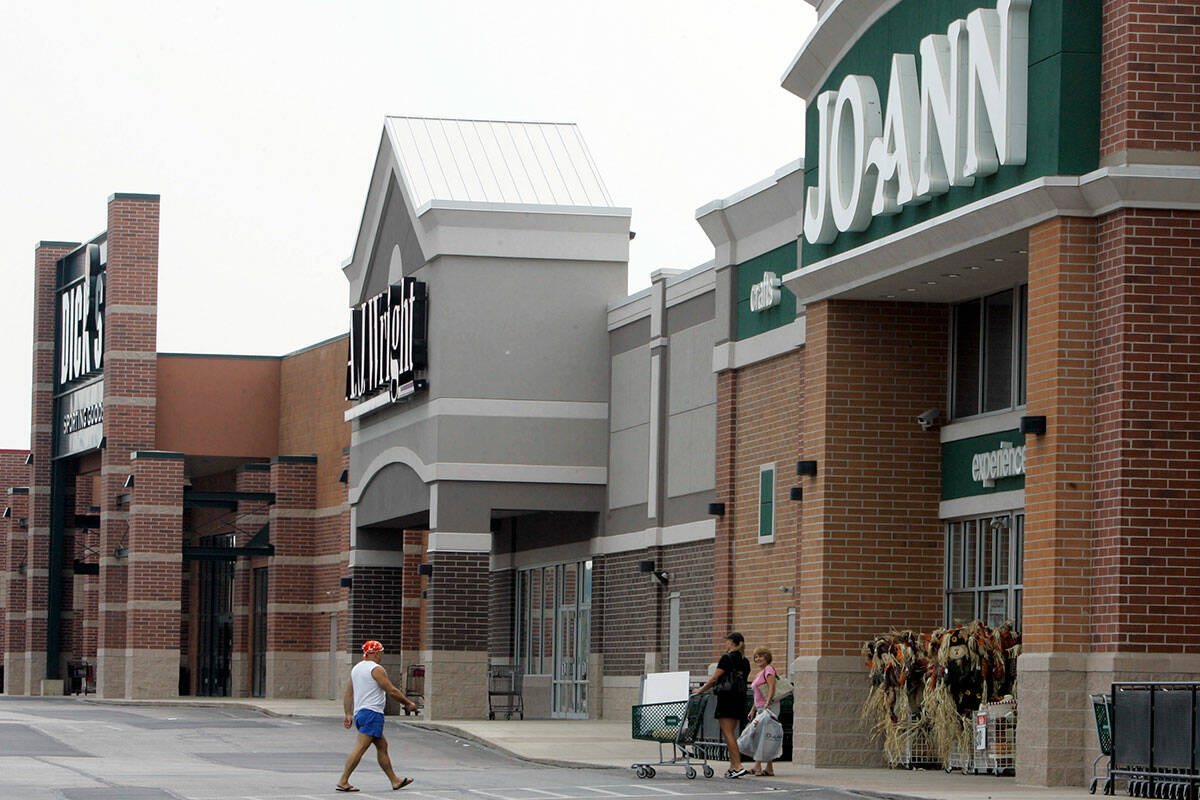 People walk into and out of a Joann store, Sept. 6, 2007, in Garfield Heights, Ohio. (AP Photo/ ...