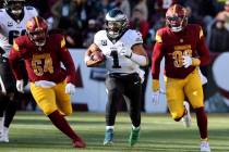 Philadelphia Eagles quarterback Jalen Hurts (1) runs with the ball during an NFL football game ...