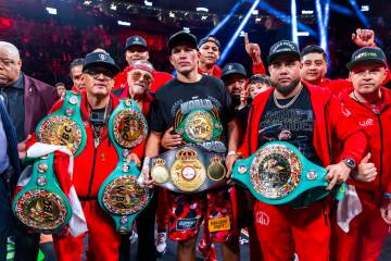 David Benavidez and his team celebrate their win over David Morrell Jr. after 12 rounds of thei ...