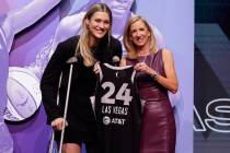 Virginia Tech's Elizabeth Kitley, left, poses for a photo with WNBA commissioner Cathy Engelber ...