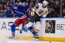 New York Rangers' Matt Rempe (73) fights for control of the puck with Vegas Golden Knights defe ...