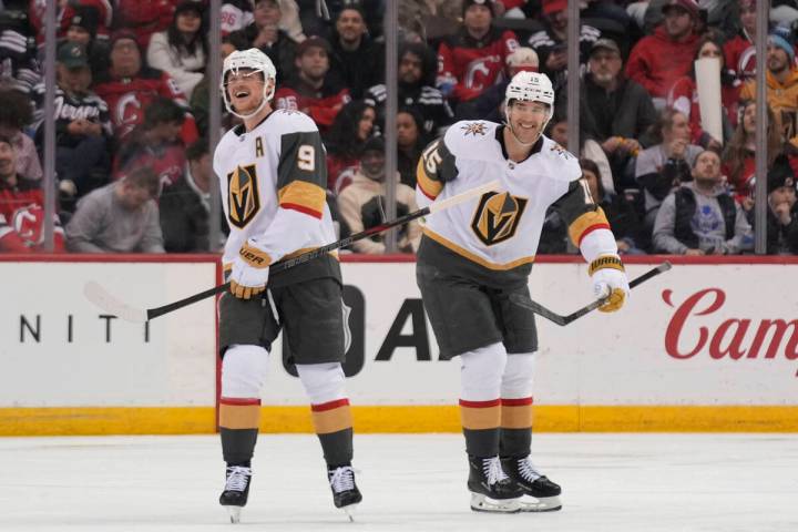 Vegas Golden Knights' Jack Eichel, left, celebrates his goal with Noah Hanifin during the third ...