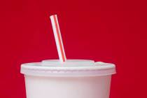 A large soft drink with a plastic straw from a McDonald's restaurant is shown in Surfside, Fla. ...