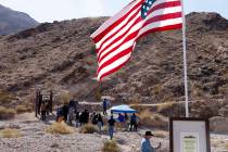 People gather at the Great Unconformity site at Frenchman Mountain on Monday, Feb. 17, 2025, in ...