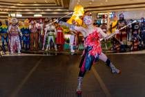 Performers with "Ka" conduct a small celebration performance in the grand lobby of the MGM Gran ...