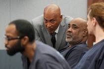 Duane "Keffe D" Davis, center right, speaks with attorney Carl E.G. Arnold during a court appea ...