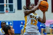 Democracy Prep guard Keonni Lewis (13) elevates for a shot over Bishop Gorman guard Aaliah Spai ...