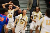 Democracy Prep players celebrate from the bench during a Class 5A girls basketball state semifi ...