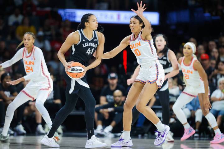 Aces center Kiah Stokes (41) moves to pass the ball to a teammate as Connecticut Sun forward Ol ...