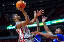 UNLV guard Jaden Henley (10) shoots over San Jose State Spartans guard Josh Uduje (9) and cente ...