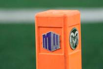 Mountain West Conference emblem is attached to a field marker along with the emblem of Colorado ...