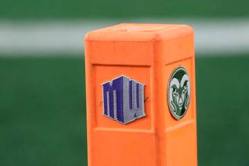 Mountain West Conference emblem is attached to a field marker along with the emblem of Colorado ...