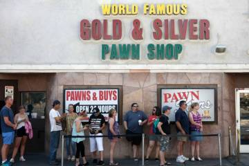 People wait in line to enter the Gold and Silver Pawn Shop in Las Vegas on Monday, June 25, 201 ...