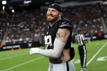 Raiders defensive end Maxx Crosby (98) laughs on the sideline during an NFL football practice a ...