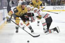 Vegas Golden Knights defenseman Brayden McNabb (3) and Chicago Blackhawks center Craig Smith (1 ...