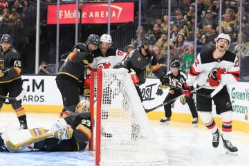 New Jersey Devils defenseman Brett Pesce (22), right, reacts after failing to score a goal past ...