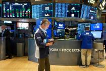 People work on the floor at the New York Stock Exchange in New York, Thursday, Feb. 27, 2025. ( ...