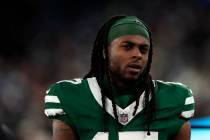 New York Jets wide receiver Davante Adams (17) reacts during an NFL football game against the M ...