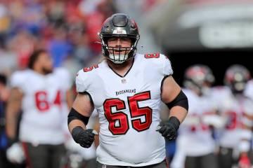 Tampa Bay Buccaneers guard Alex Cappa (65) runs onto the field during a NFL divisional playoff ...