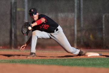 Las Vegas first baseman Dallas Martinez (25) bends to catch for an out on Liberty during a Clas ...