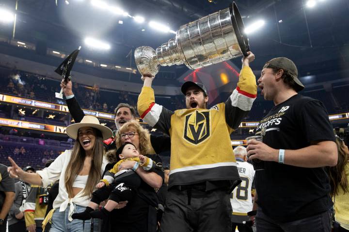 Golden Knights right wing Reilly Smith (19) poses with his family and the Stanley Cup after the ...