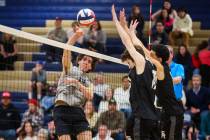 Palo Verde outside hitter Andrew Gutierrez (15) hits the ball over the net during a high school ...