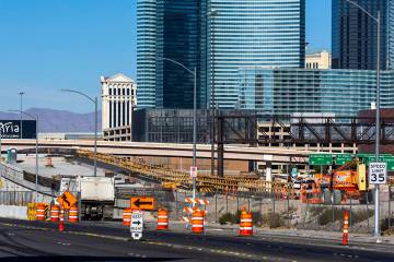 A crew continues to work on the bridge southbound from Tropicana Avenue onto the I-15 and other ...