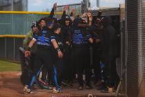 Basic teammates celebrate Andruw Giles (29) as he makes his way back to the dugout during a hig ...