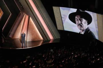 Morgan Freeman speaks about Gene Hackman with an image of Gene Hackman on the screen during the ...