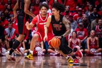 UNLV guard Brooklyn Hicks, right, looks for an opening while guarded by New Mexico guard CJ Nol ...