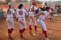 Arbor View high school softball players celebrate after Madilyn Lowy (3) hit a walk off single ...