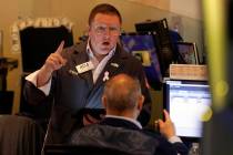 Traders work on the floor of the New York Stock Exchange, Tuesday, March 11, 2025. (AP Photo/Ri ...